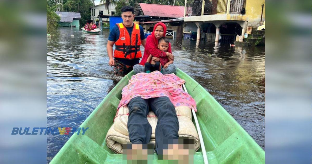 Kasih isteri, tarik mayat suami dalam banjir 